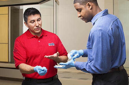 Cintas representative explains how to remove gloves after taking care of an emergency.