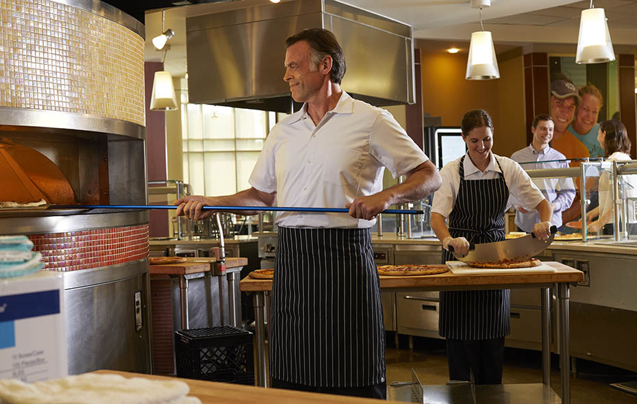 Pizza Chef wearing a ChefWorks® Chalk Stripe Apron